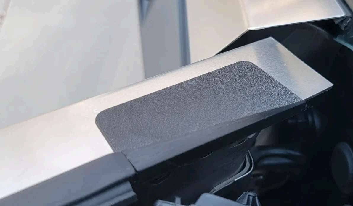 Mirror-delete cover installed over a side-mirror opening